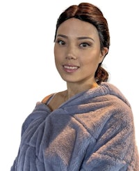 a woman wearing a blue hooded blanket